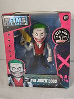 Front view of boxed Joker Boss die-cast figure