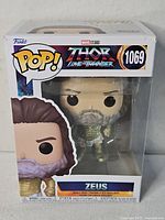 Front of sealed Funko Pop box showing Zeus figure and #1069 labeling