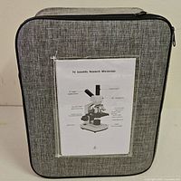 Grey fabric carry case with printed label