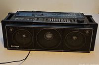 Front view of Hitachi boombox showing three speakers and overall condition