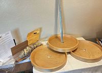 Three wood trays, mounting pole, hardware in bags, paperwork