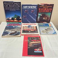 All seven books front covers displayed on table