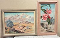 Both framed desert paintings side by side