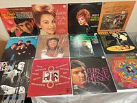 Overview of all 12 LP covers laid out on table