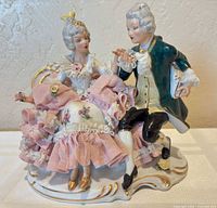 front view of Dresden lace porcelain couple figurine on white surface