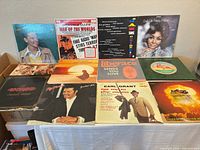 All 12 record jackets displayed on table