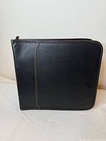 Front view of black zippered CD/DVD binder