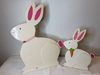 Both wooden bunny decorations side by side