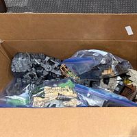 Opened box with bags of terrain pieces