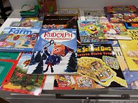 Overview of assorted children’s books spread on tabletop