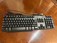 Keyboard out of box showing full layout and USB cable