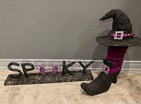 Overall view showing SPOOKY sign, witch hat, and boot