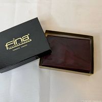 Wallet inside Fina box, lid beside