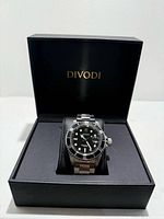 Watch displayed in open DIVODI box