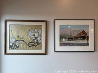 Both framed artworks side by side on wall