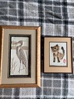Both framed artworks side by side