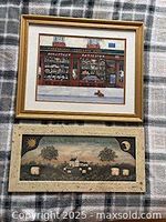 Both framed prints lying on blanket