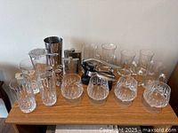 All barware items arranged on shelf