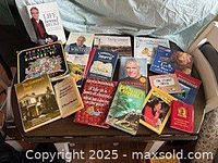 Front view of assorted modern paperbacks and hardcovers including signed editions