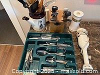 Overview showing flatware tray, knife block, utensil crock, pepper mill, immersion blender