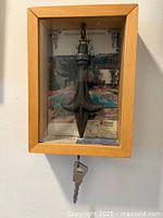 Shadowbox with hotel key fob and key