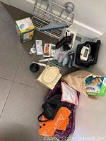 Overview of health and bathroom items spread on floor