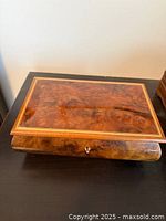 Closed wooden music jewelry box top view