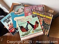 Pile of vinyl LP records with visible titles such as Four Aces Sing and Enjoy Light and Easy