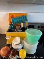 Group shot showing cooler, thermos, ice tray, lettuce keeper and other items