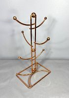 Full view of copper-finish mug tree stand front angle