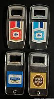 All four branded acrylic bottle openers front view