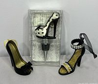 Group view: two Hallmark stiletto ornaments and boxed polka-dot shoe bottle stopper