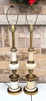 Pair of brass and ivory table lamps full view