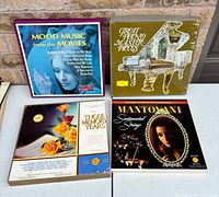 Group shot of all four vinyl LP box sets