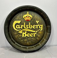 Front view of round Carlsberg Beer barrel end sign