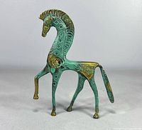 Full view of brass/bronze stylized horse figurine