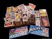 Lot overview showing loose cards in storage boxes, sleeved cards, Bowman 1991 factory box and O-Pee-Chee 1991-92 factory box
