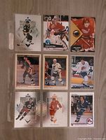 Front view of the nine mint early-1990s NHL trading cards arranged in a 3×3 grid