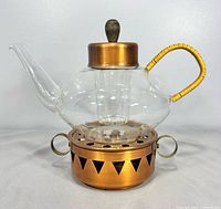 assembled teapot on copper warmer, side view