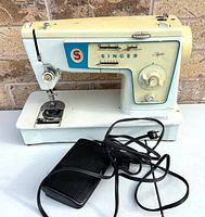 Overall view of Singer Stylist 416 sewing machine with foot pedal