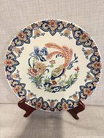 Front view of Boch Vieux Rhodes 10" plate showing full bird and floral motif and border