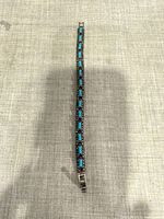 Full view of bracelet laid flat showing turquoise and marcasite links
