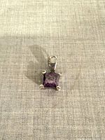 Front view of pendant showing square amethyst and bail