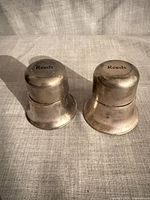 Two bell-shaped Reeds ring holders closed, exterior view