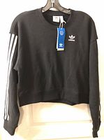 Front view showing tags, logo and cropped style