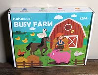 Front of sealed Hahaland Busy Farm box showing farm scene graphics and age recommendation