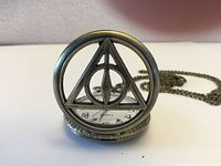 Front view showing Deathly Hallows cover and dial