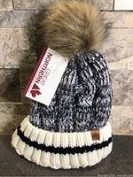 Front view of Great Northern marled knit beanie showing pom and tag