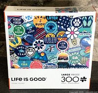 Front of sealed Life Is Good Sticker Collage 300-piece puzzle box