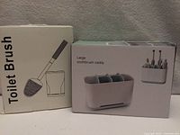 Front view of boxed toilet brush and toothbrush caddy